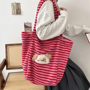 Detail of soft striped plush tote bag with a cute 3D dog patch in a home setting