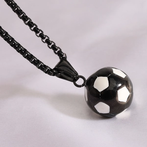 Close-up of a 19mm black and white soccer pendant with a sleek black box chain link