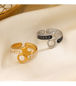 Detail showing Forever and Silver engravings on stylish 18K gold plated wrench rings