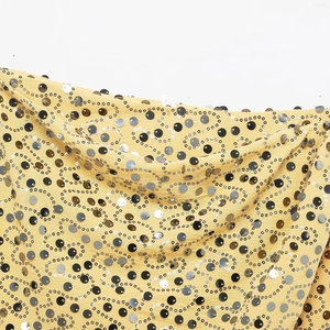 Sparkly sequin wrap mini skirt in yellow fabric with gold and silver wave patterns