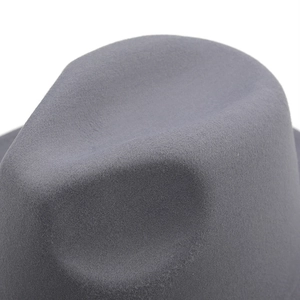 Close-up of gray two-tone felt fedora hat with dimpled crown and flat brim for unisex style