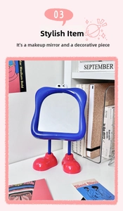 Detail of creative desktop makeup mirror with blue frame and red shoe-shaped base stand