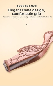 Macro detail of crane-shaped rose gold ear cleaning tool with anti-slip matte finish