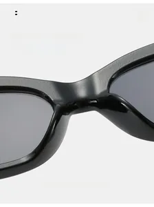 Detail view of comfortable nose pads on black thick frame retro sunglasses