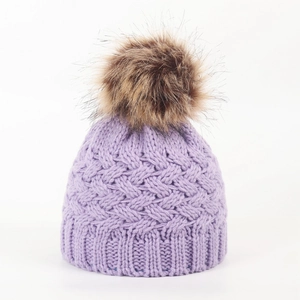 Winter infant knit hat in purple with large fluffy faux fur pompom for baby warmth