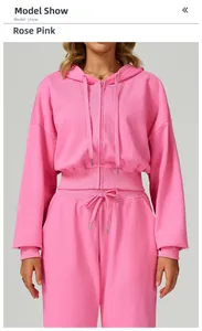 Detail of rose pink zip-up hooded tracksuit featuring ribbed cuffs and matching drawstring