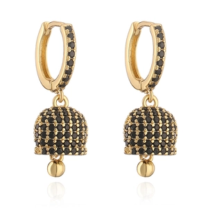 Detailed close-up of bell-shaped drop earrings featuring gold plating and black crystals