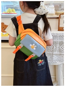 Detail of colorful PU leather kids crossbody bag with daisy embroidery and adjustable strap