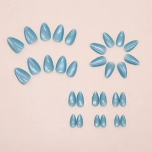 Detail of light blue cat eye press on nails in almond shape with pearlescent finish