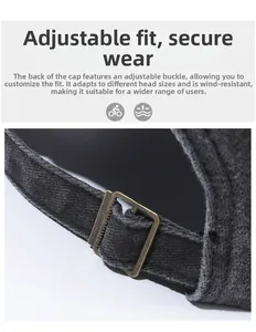 Detail of vintage bronze metal buckle on the adjustable dark grey cotton baseball cap