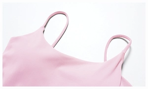 Close-up of pink yoga tank top showing fine stitching and soft brushed fabric straps
