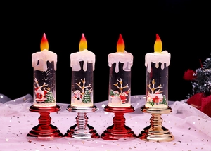 Row of four festive Christmas LED candles with Santa, snowman and reindeer scenes