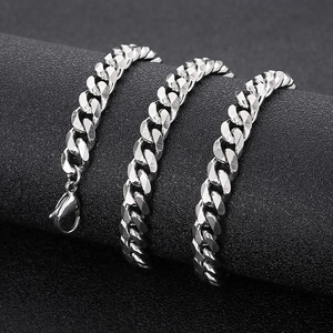 Detailed close-up of a silver stainless steel Cuban chain on a professional display stand