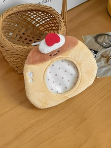 Detail of plush dessert-shaped badge holder with clear window and cherry topping
