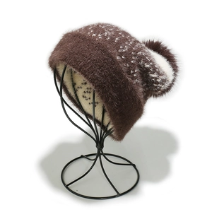 Close-up of brown winter knit hat with soft faux fur texture and warm plush lining