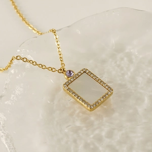 Gold stainless steel necklace with rectangle pearl shell pendant and crystal accents