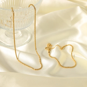 Elegant 18K gold plated stainless steel bead necklace and bracelet set on silk