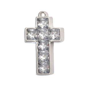 Detailed view of silver stainless steel cross pendant with sparkling cubic zirconia stones