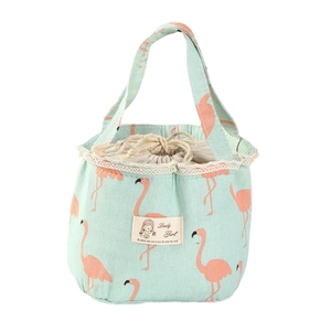 Mint green canvas lunch bag with pink flamingo print and drawstring lace detail