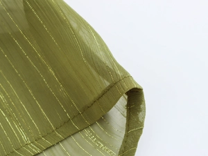 Close-up of green sheer mesh fabric with metallic gold stripes and fine texture