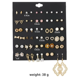 Detail view of 30 pairs assorted stud earrings set with sizes from 0.4cm to 1cm on black card