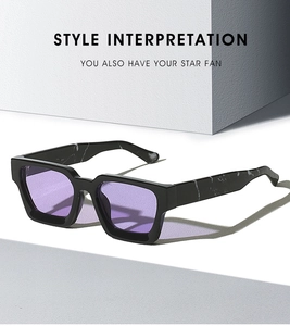 Detail of square sunglasses with purple lenses and marble textured temples on steps