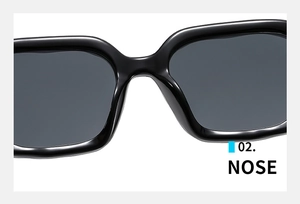 Close-up detail of the smooth integrated nose bridge on black square fashion sunglasses