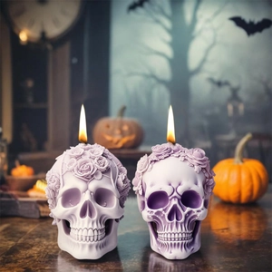 Lavender rose skull aromatherapy candle with intricate gothic carving shown lit