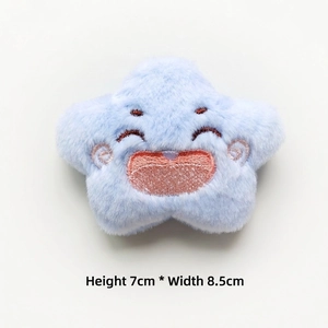 Detail of light blue plush star with embroidered smiley face, 7cm height by 8.5cm width
