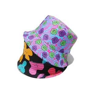 Tie-dye and black graffiti bucket hats with melting smiley faces and colorful floral prints