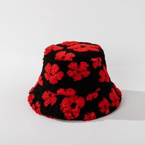 Detailed texture of plush fuzzy bucket hat with red flower pattern on black fleece