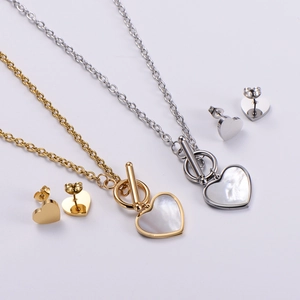 Detail view of heart-shaped shell jewelry sets with OT buckle necklaces and stud earrings