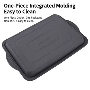 Dark gray silicone brownie pan with non-stick surface and handles for home baking
