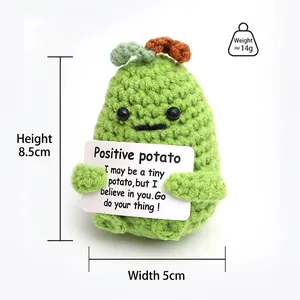 Detail showing hand-knitted green potato doll with motivational quote card 8.5cm height