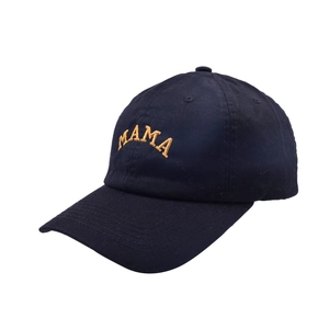 Close-up of golden MAMA embroidery on a navy blue cotton twill baseball cap
