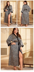 Detail of leopard print satin robe featuring contrast black trim and silk-like texture