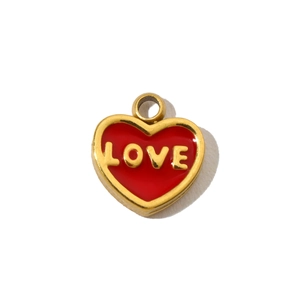 Detail of red enamel heart pendant with gold metal trim and embossed LOVE letters