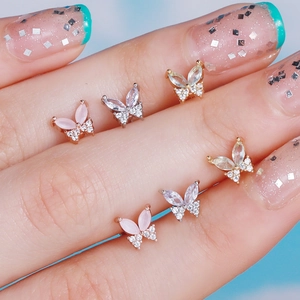 Three-color butterfly ear studs with marquise-cut stones and fine micro-pave crystals