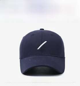 Detailed front view of navy blue cotton baseball cap featuring white slash embroidery