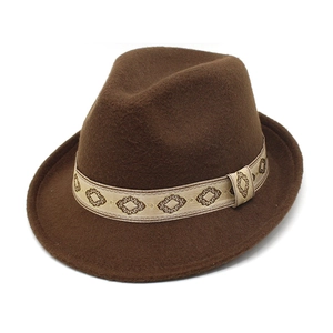 Detail of dark brown wool felt fedora featuring a champagne geometric jacquard ribbon band