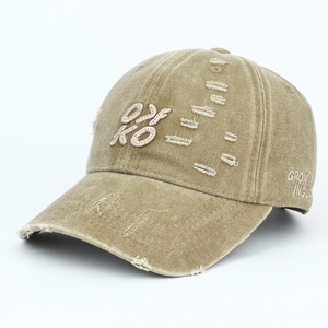 Vintage washed khaki baseball cap with OKO embroidery and distressed ripped details