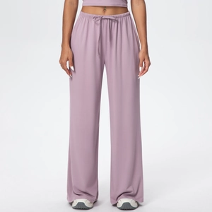 Detail of lavender wide-leg trousers featuring elastic waistband and adjustable drawstrings