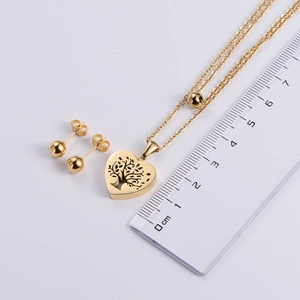 Gold-tone stainless steel jewelry set with tree of life heart pendant and ball earrings