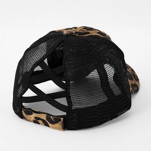 Detail view of leopard print baseball cap with cross elastic bands for ponytails