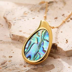 Macro shot of 18k gold plated water drop pendant featuring colorful abalone shell inlay