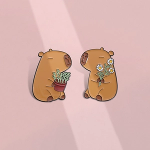 Cute capybara enamel pin set with flower and plant motifs for backpacks and accessories