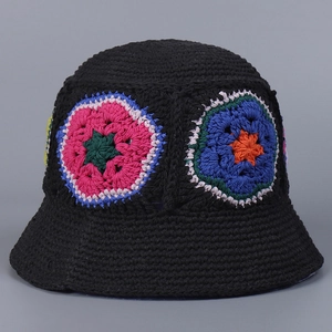 Detailed crochet texture and colorful mandala flower patterns on a black cotton bucket hat