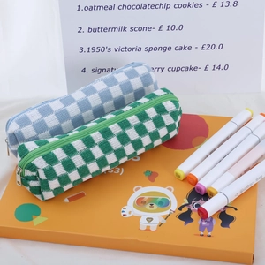 Checkered knit pencil pouch in blue and green with a zipper closure and soft texture