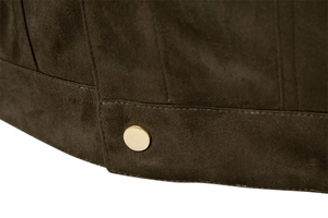 Close-up of the olive suede jacket hem with precise stitching and a gold metal button
