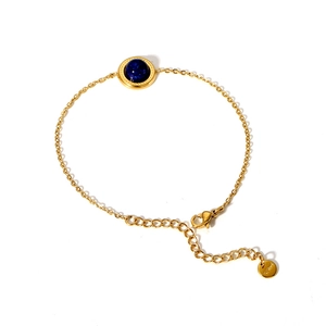 14K gold plated stainless steel bracelet with a deep blue bead on a white background
